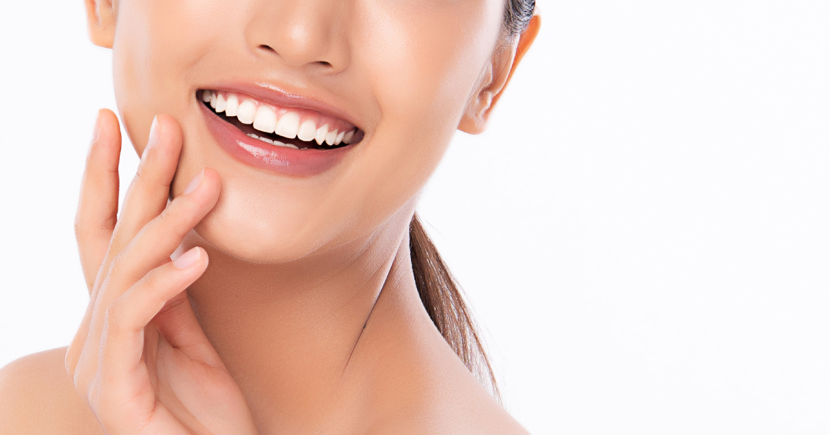 Close-up of a woman smiling with bright white teeth highlighting the results of professional Teeth Whitening in Provo, UT.